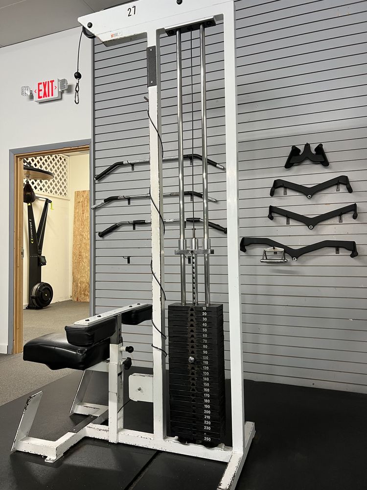 Cable tower with a full wall of attachments at Phoenix Fitness gym in Toccoa, GA